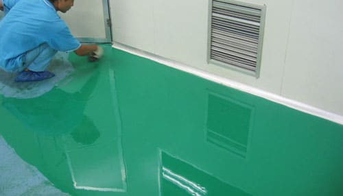 painting floor with adhesive green epoxy