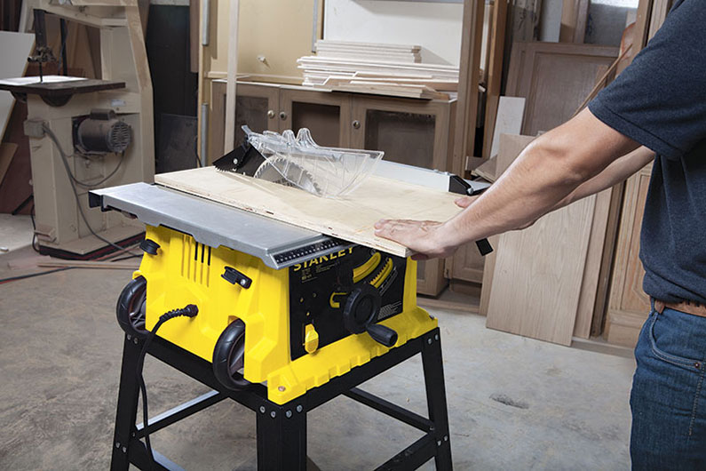 image of a man using a table saw